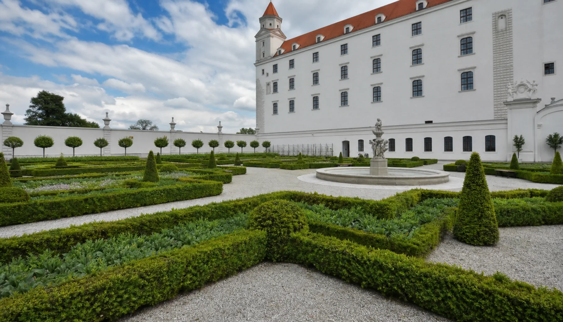 The Baroque garden on the northern side, recreated on the historical plan — parterres, clipped hedges and fountains