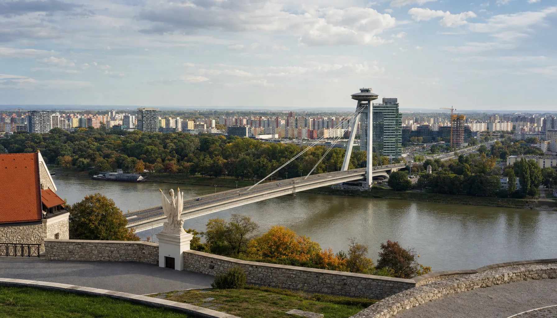 South from the terrace: the Danube, the Most SNP with its saucer tower, and the panel blocks of Petržalka beyond