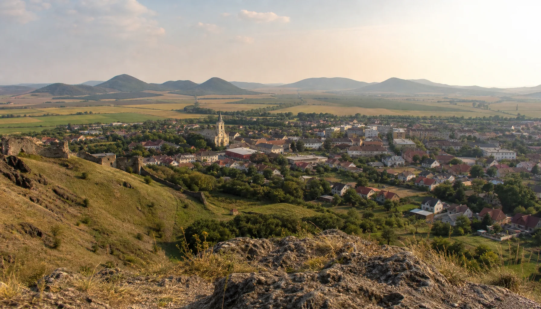Fiľakovo seen from the castle — a border town on flat, open ground
