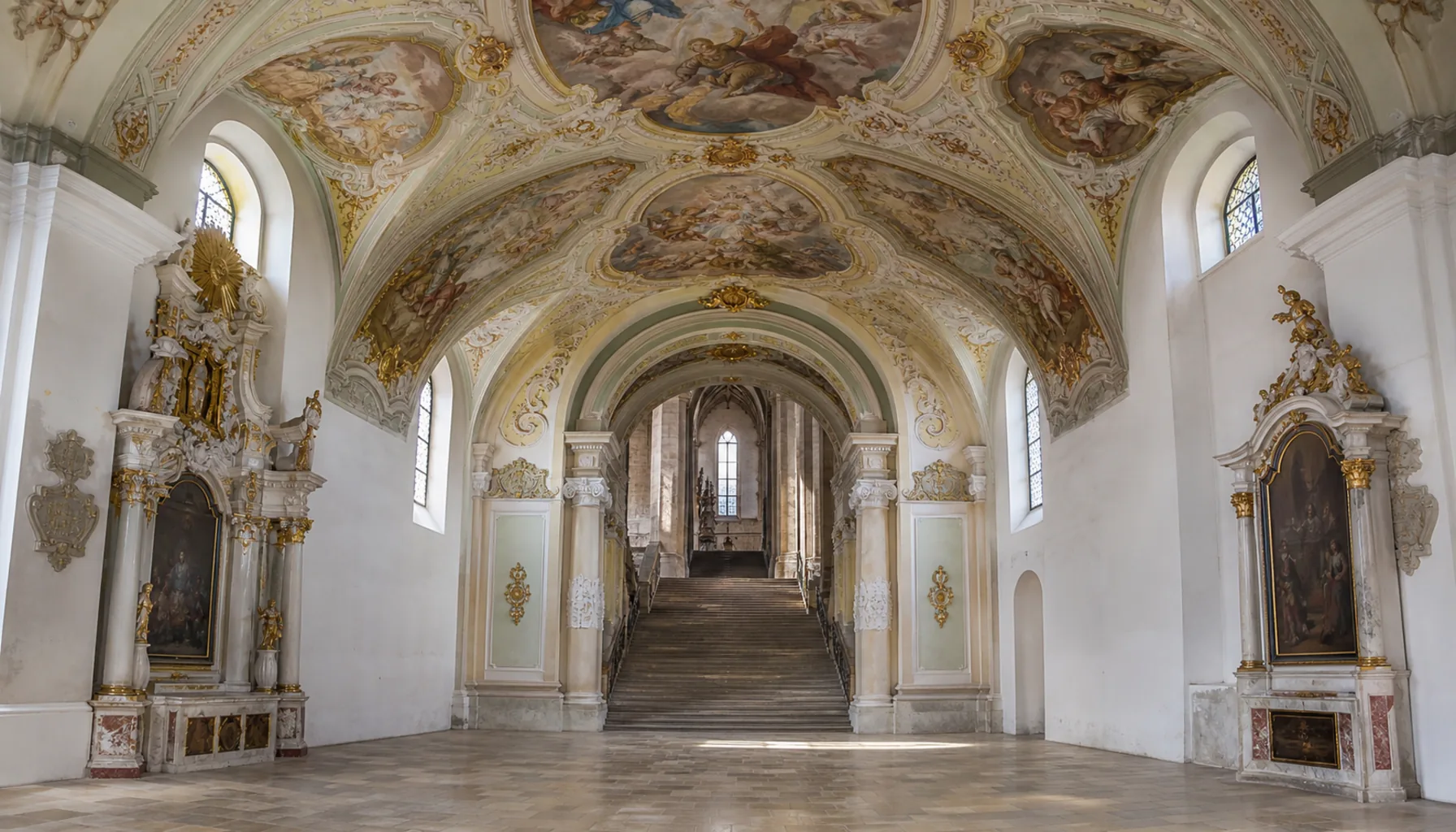 Inside St Emmeram's: the Baroque Lower Church, with steps leading up to the Gothic level above