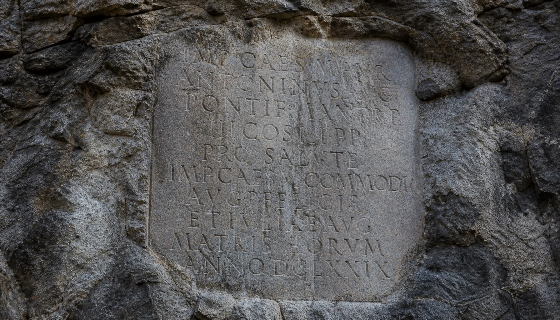 The Roman inscription of 179 AD, cut into the castle rock at the foot of the crag
