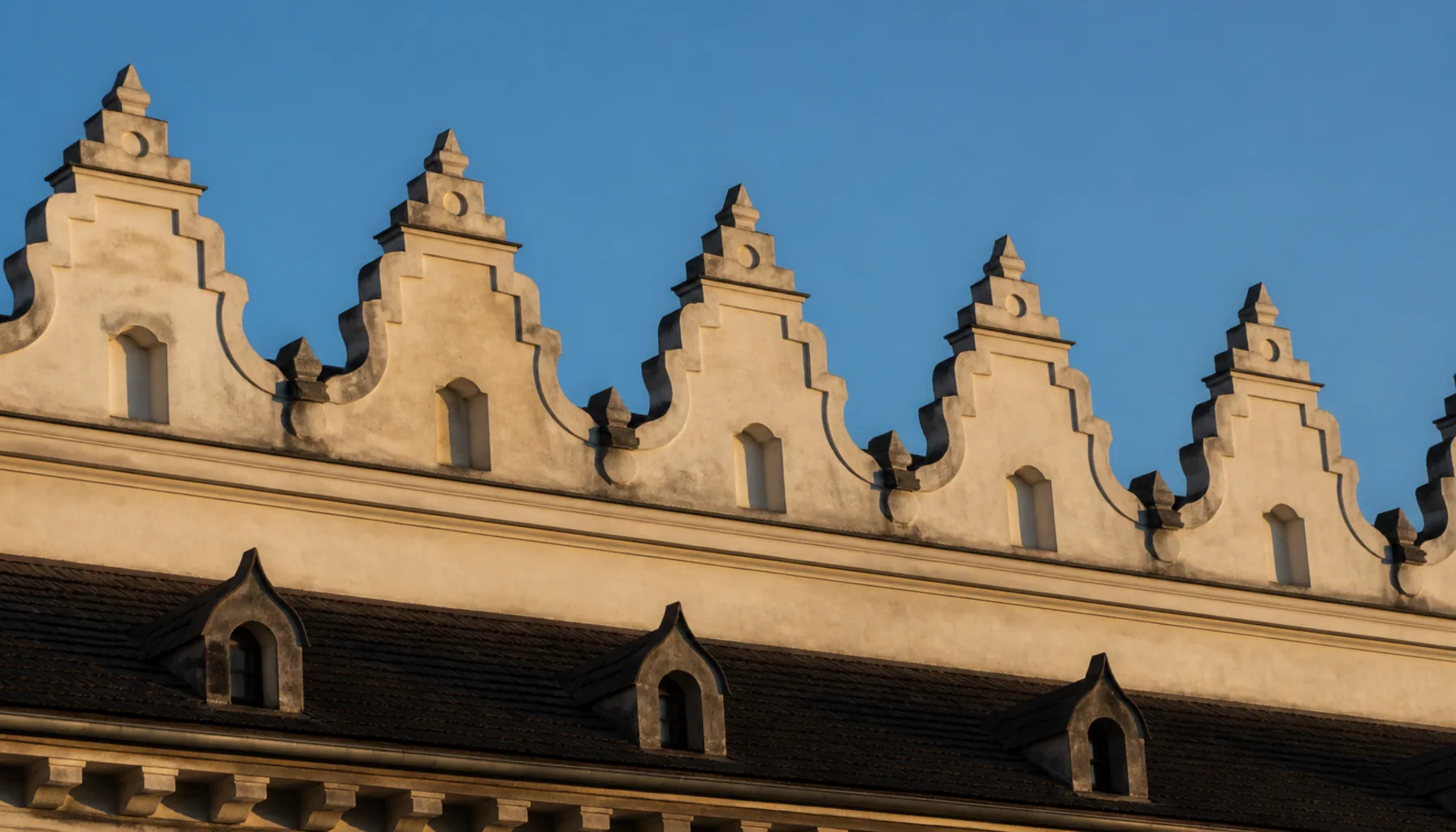 The crenellated Renaissance attic against the sky — the castle’s answer to the Ottoman wars