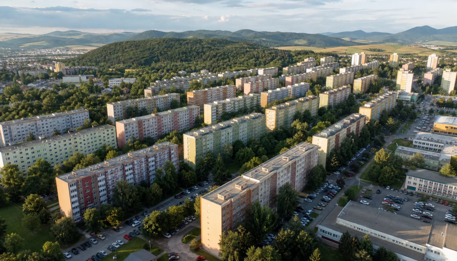 Sekčov from the air — the ranked slabs of Prešov's largest housing estate, with the hills of Šariš closing the horizon