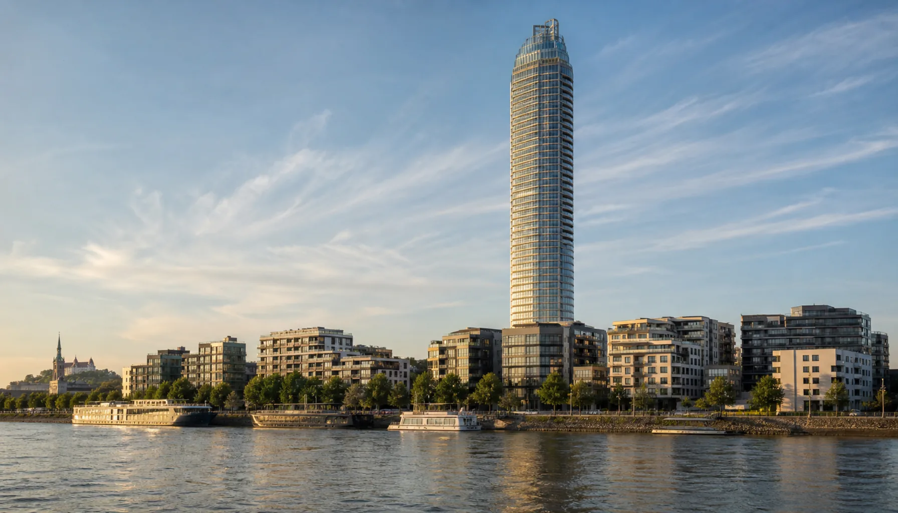 Eurovea Tower from the Danube — 168 metres of glass, the tallest building in Slovakia