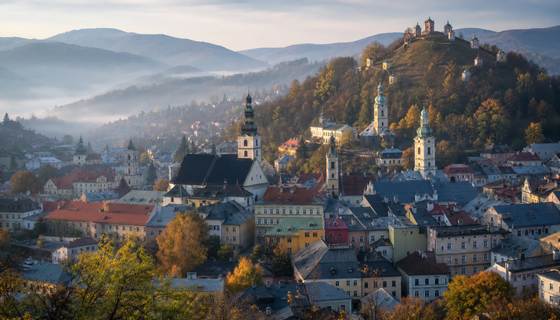 Banská Štiavnica in its volcanic bowl, the calvary on its cone behind
