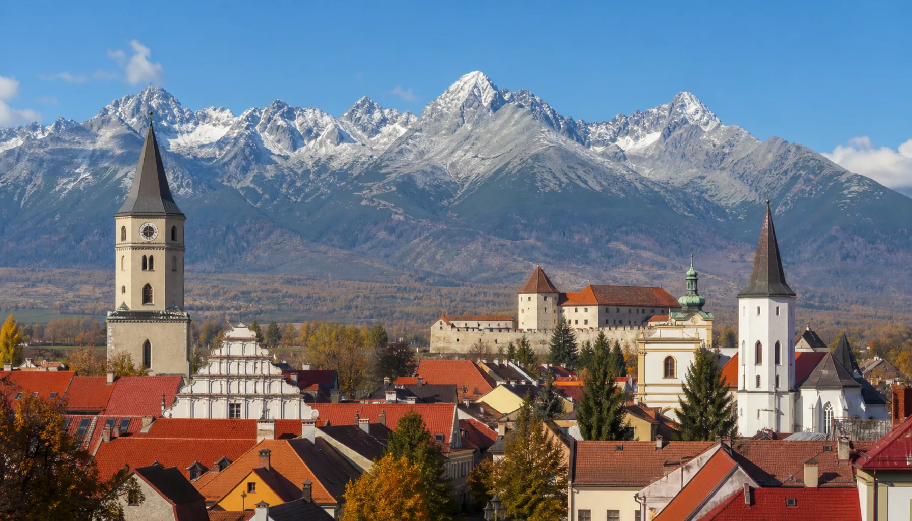 The rooftops of Kežmarok with the High Tatras behind