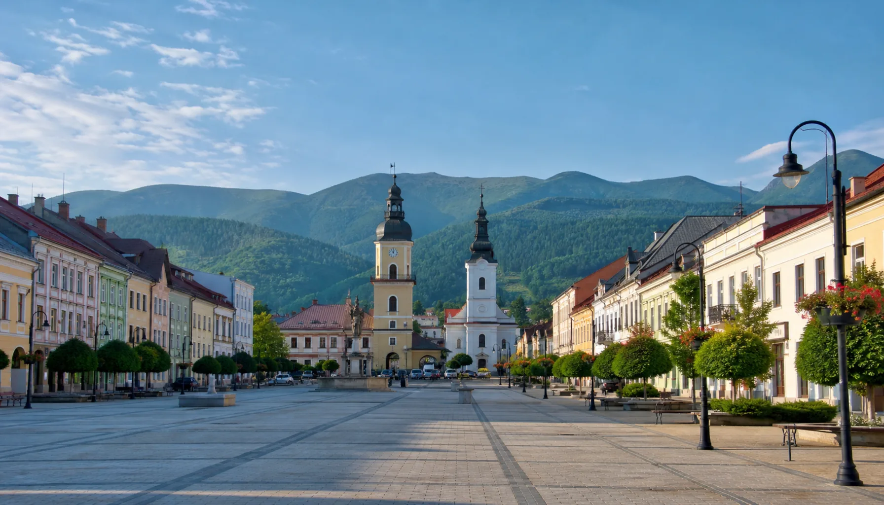 Brezno's long main square, with the Low Tatras rising beyond the rooftops