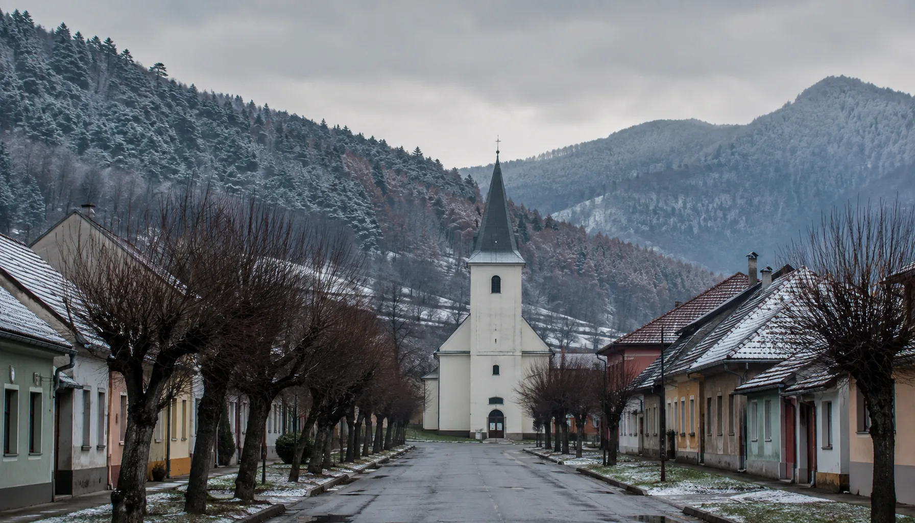 The Lutheran church on Hnúšťa's main street, under the forested Vepor ridges that close the Rimava valley on both sides