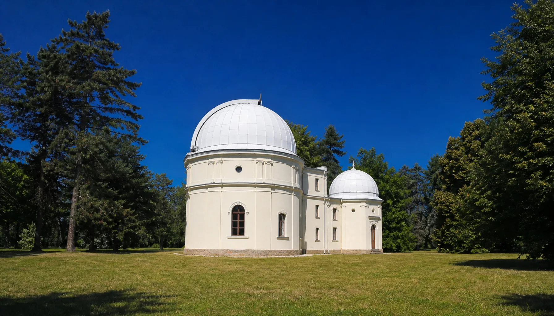The domes of the Slovak Central Observatory in its park at Hurbanovo