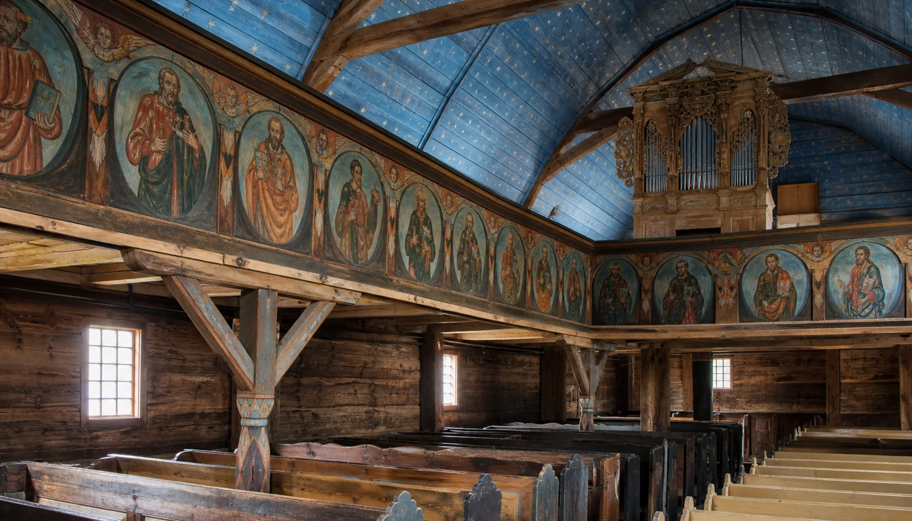 Inside the wooden articular church of 1717 in Kežmarok: painted timber walls and galleries, and an organ whose pipes are made of wood