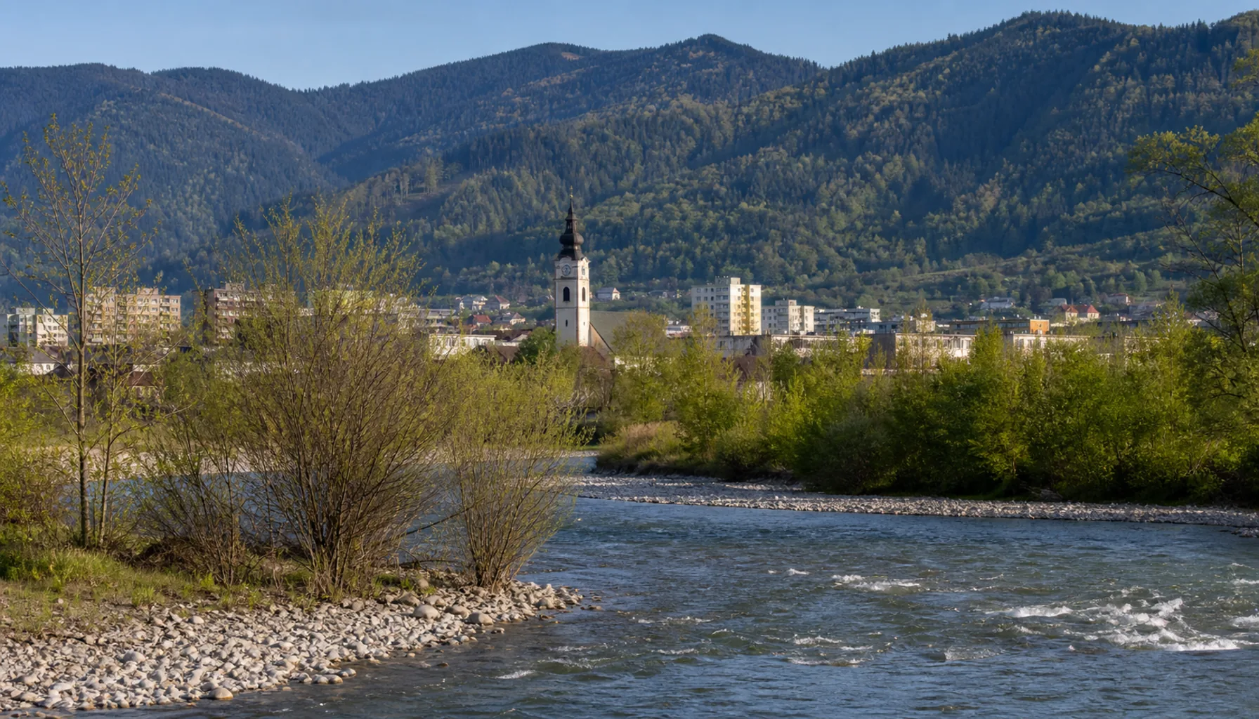The Kysuca river running past Kysucké Nové Mesto below wooded ridges