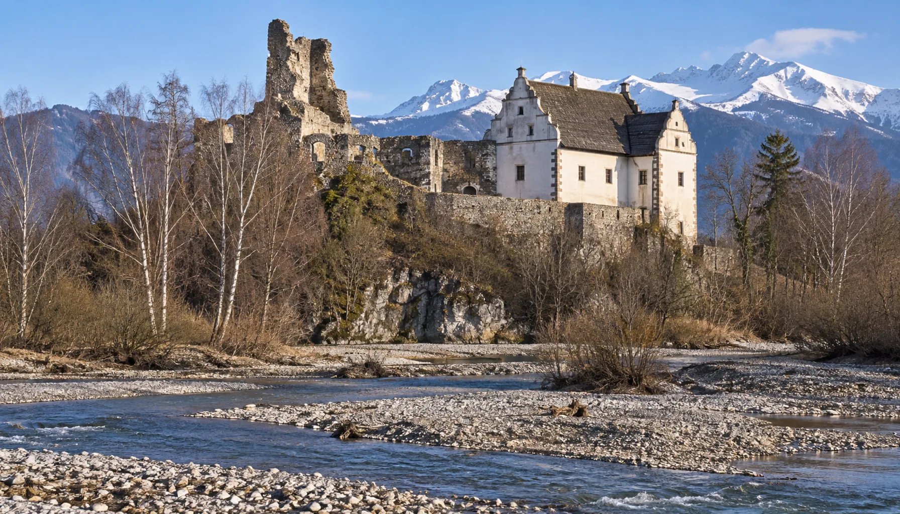 The castle ruin at Liptovský Hrádok with the Renaissance manor house built against it, above the Váh