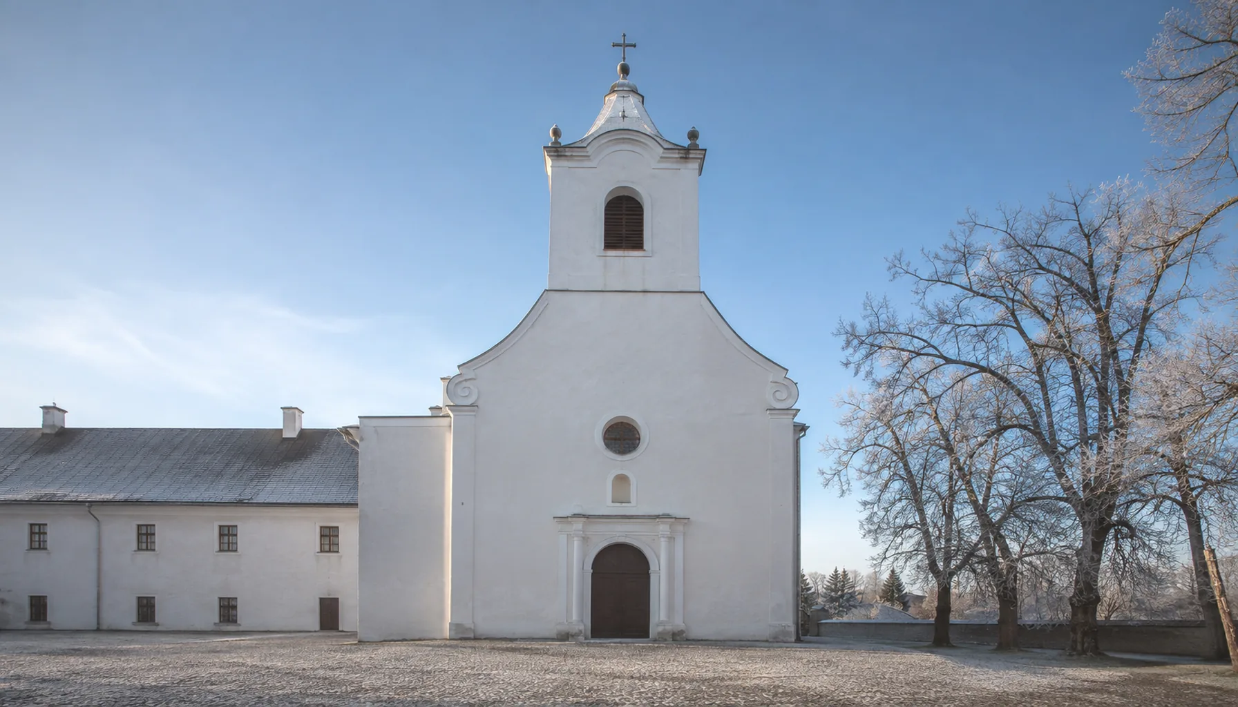 The plain white front of the Franciscan monastery church in Malacky, which holds a copy of the Holy Stairs of Rome