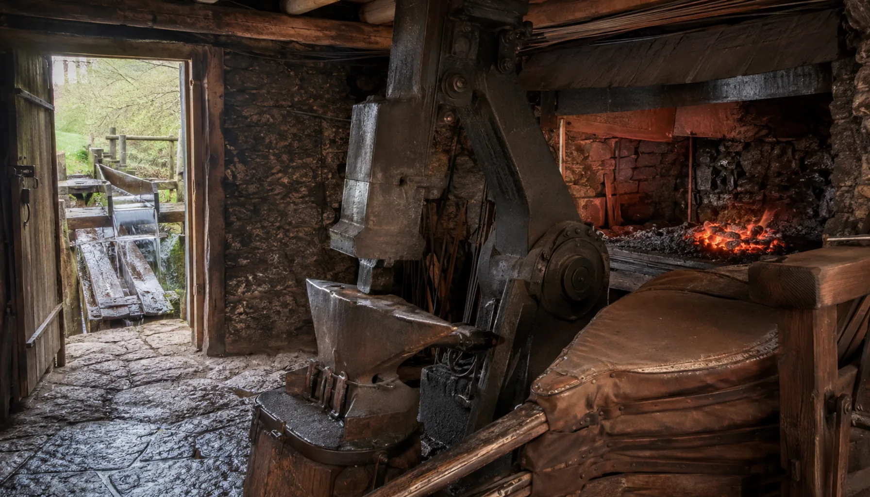 Inside a Medzev hammer forge: the water-driven tilt hammer, the anvil and the hearth that made hand-forged tools here