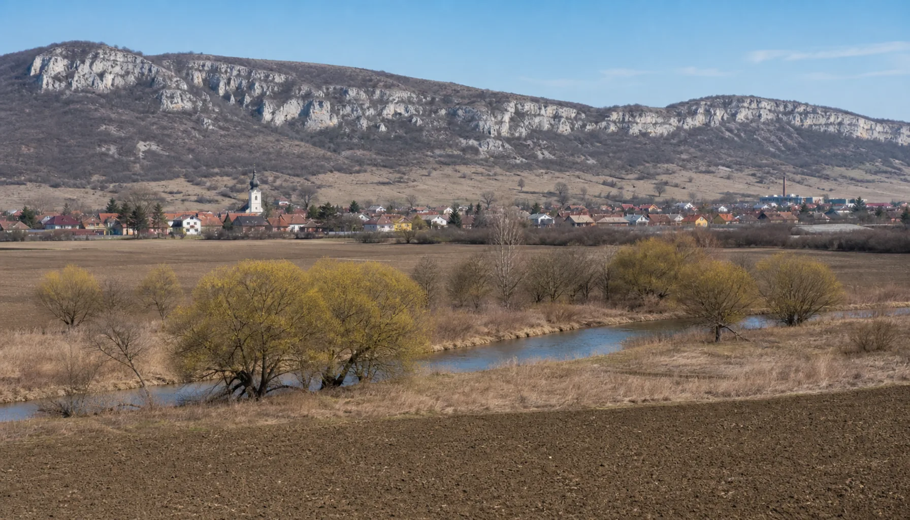 The Bodva valley at Moldava nad Bodvou with the limestone edge of the Slovak Karst behind
