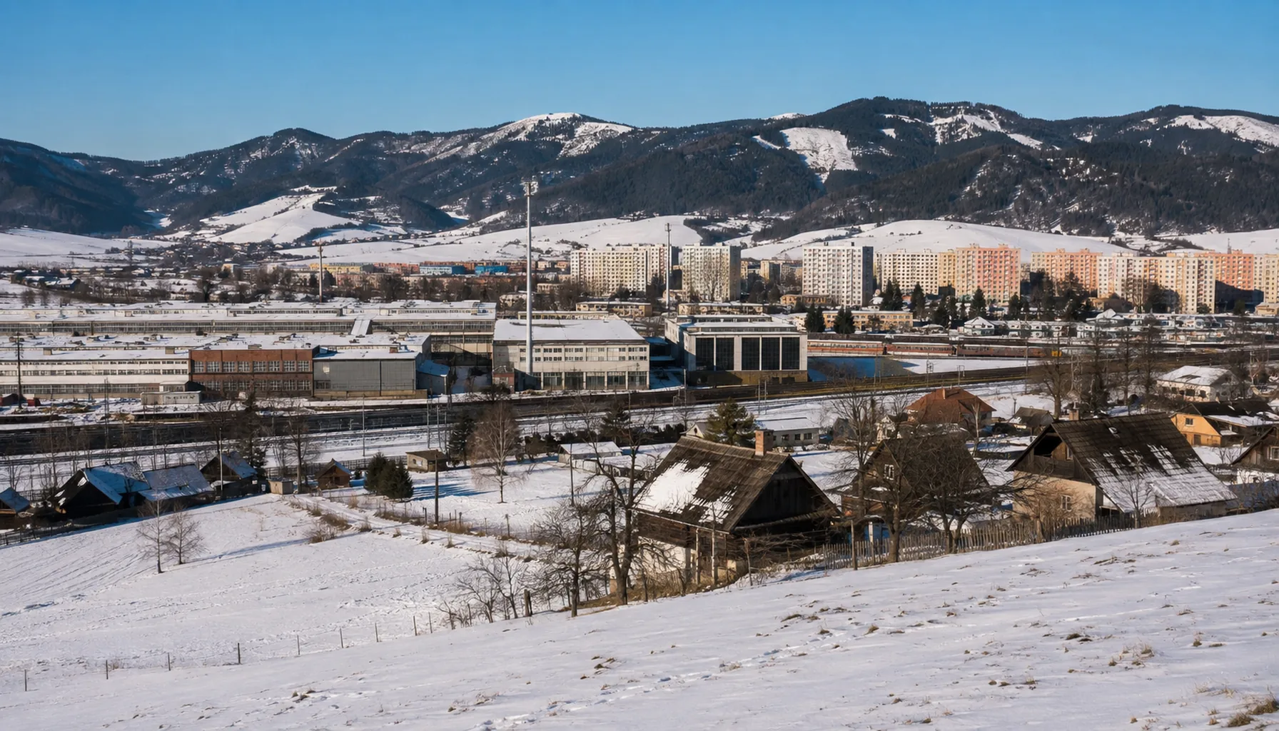 The electronics works at Nižná and the blocks of flats built for it, under the Skorušinské vrchy in winter