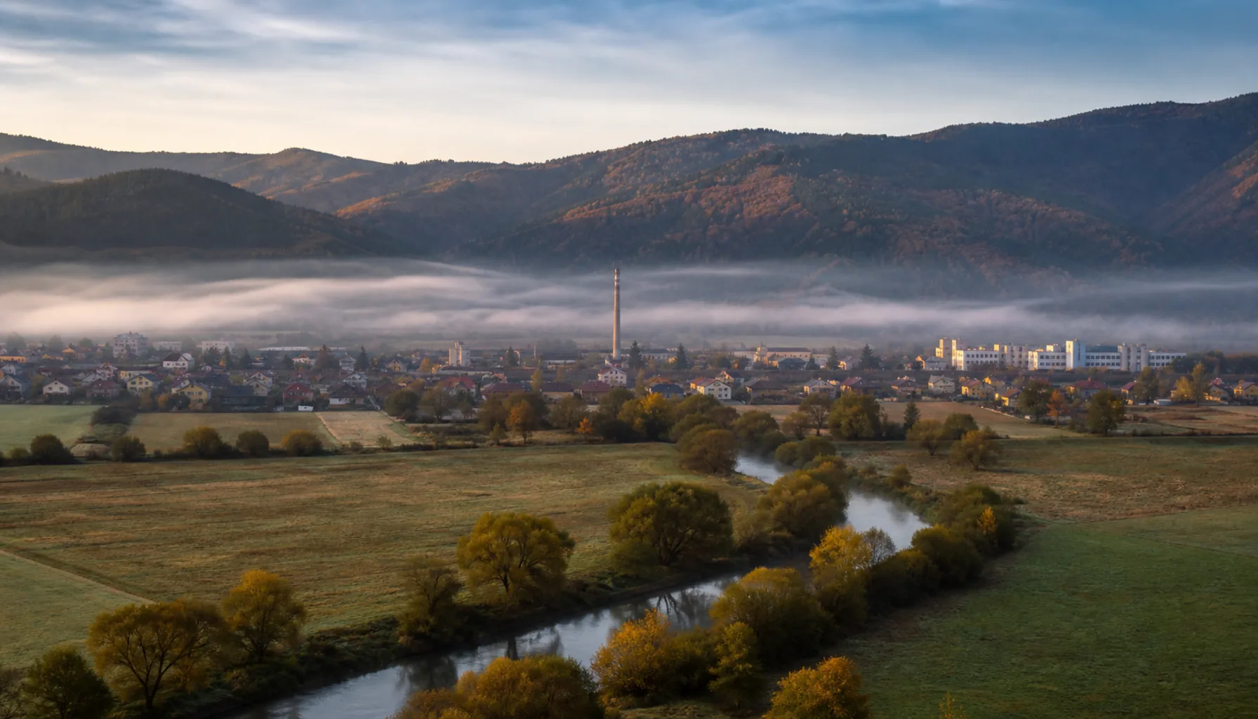 The upper Ipeľ valley at Poltár, with the wooded foothills of the Vepor behind the town