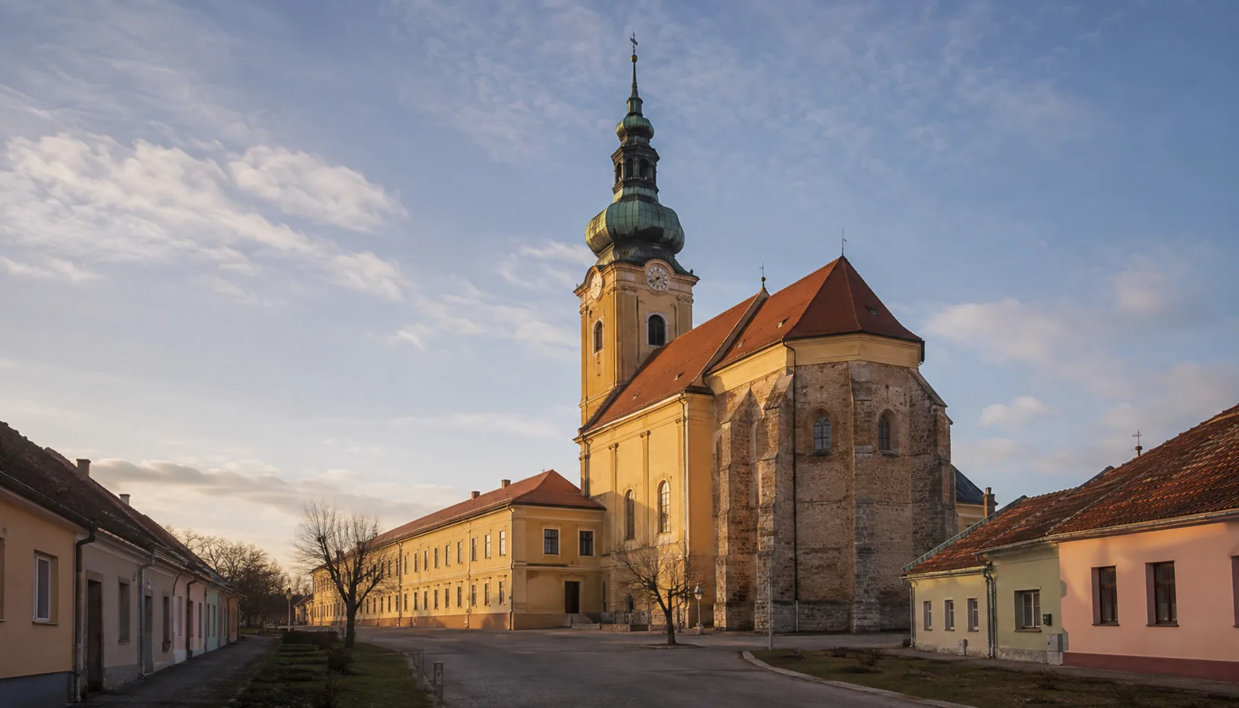 The Baroque former Premonstratensian provostry church and monastery range at the head of the market square in Šahy