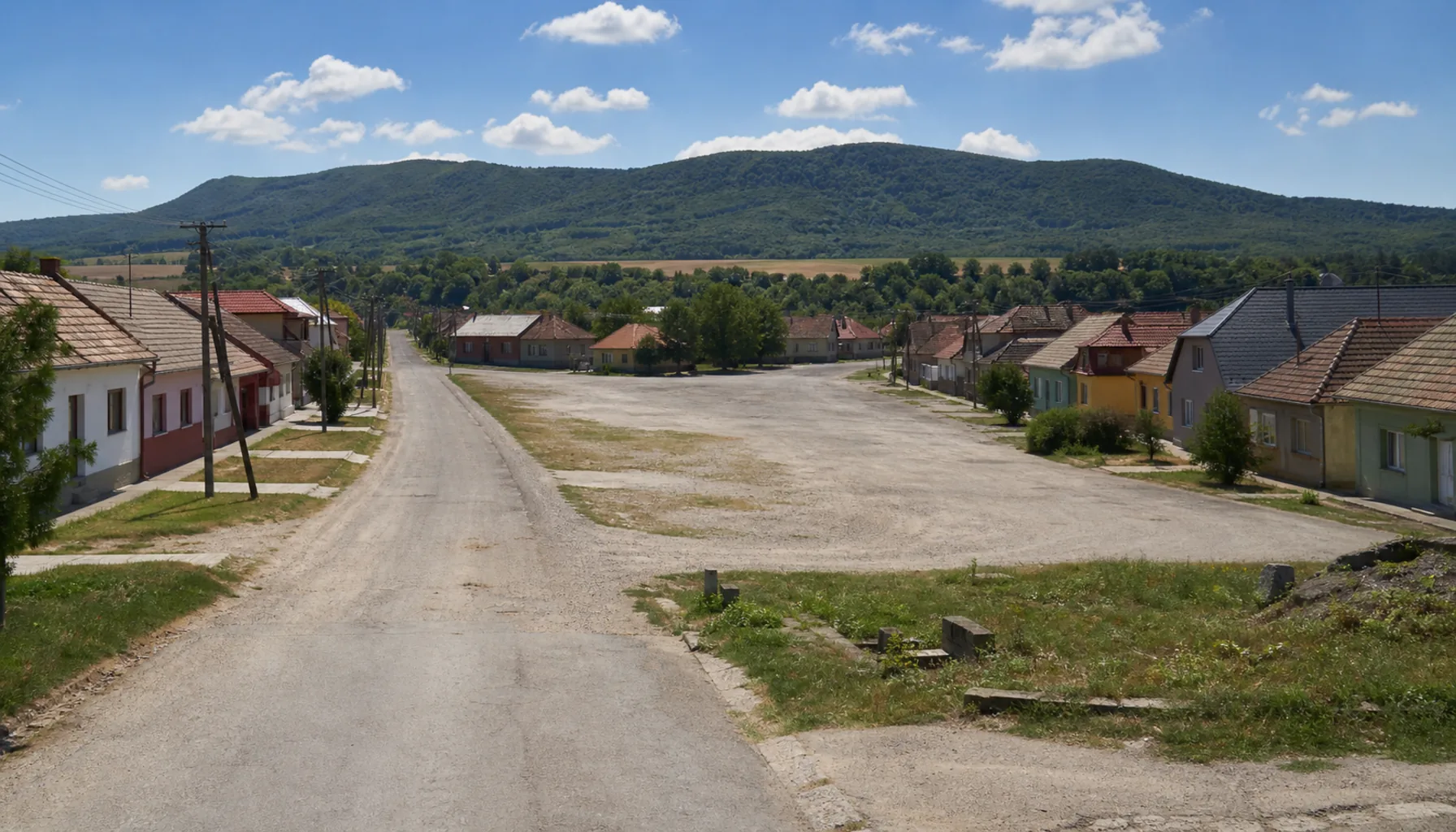 The long market street of Sečovce, widening in the middle where the fairs were held, under the Slanské vrchy