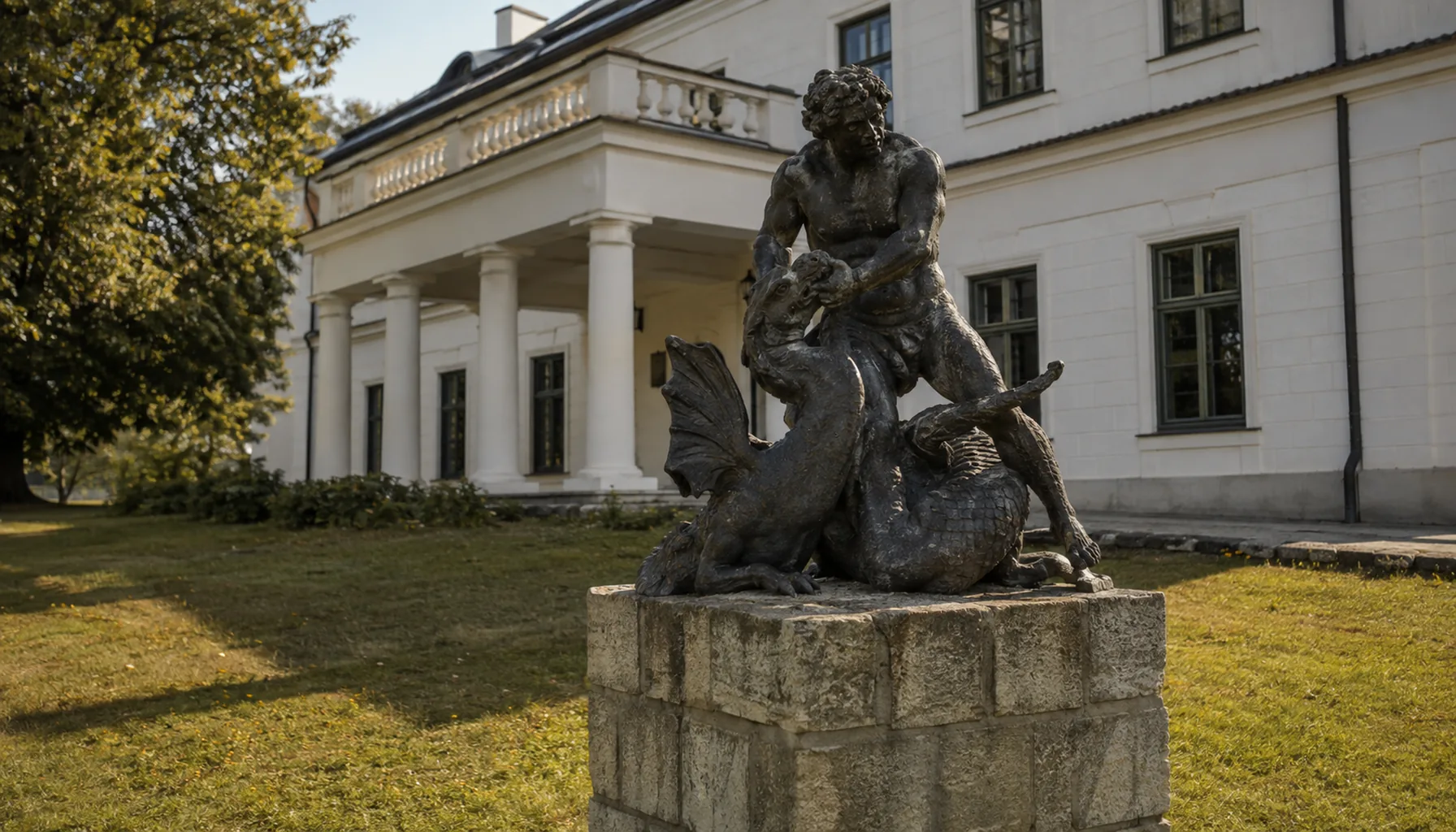 The cast-iron Hercules and dragon in Snina's town park, cast at the local ironworks and now the town's emblem, in front of the classicist manor house