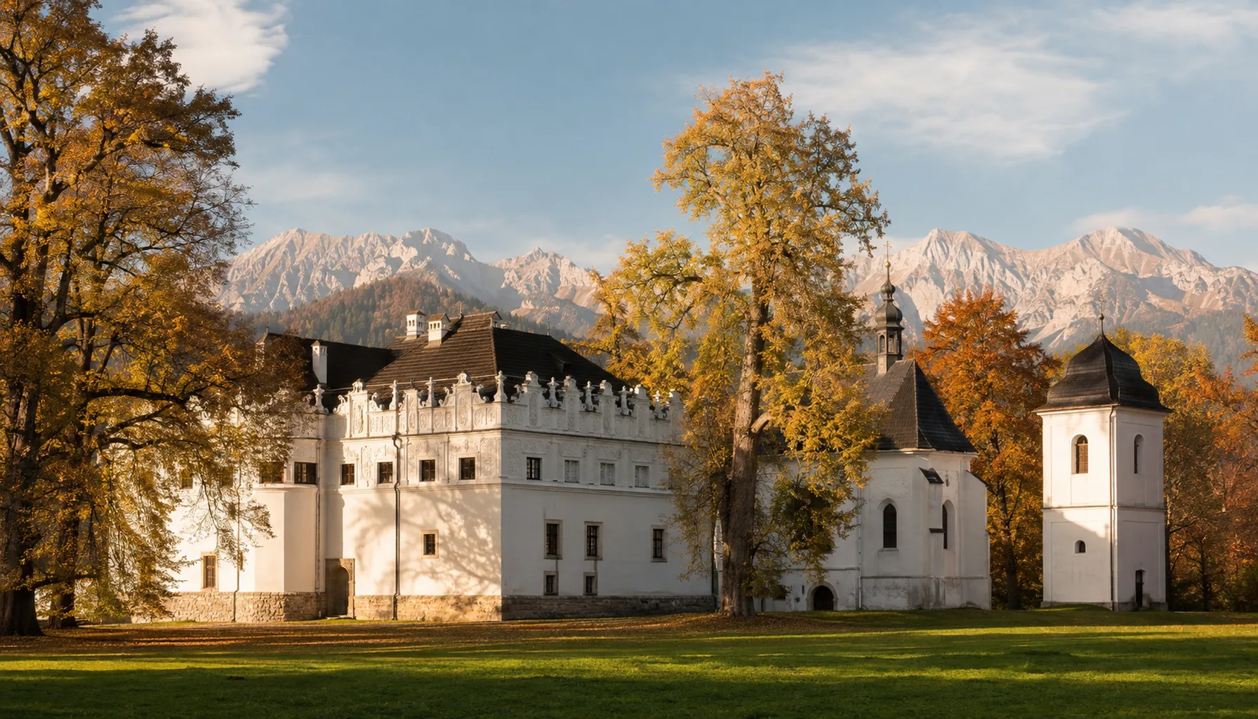 The Renaissance manor of Strážky on the edge of Spišská Belá, with its church, bell tower and park of old trees under the Belianske Tatry