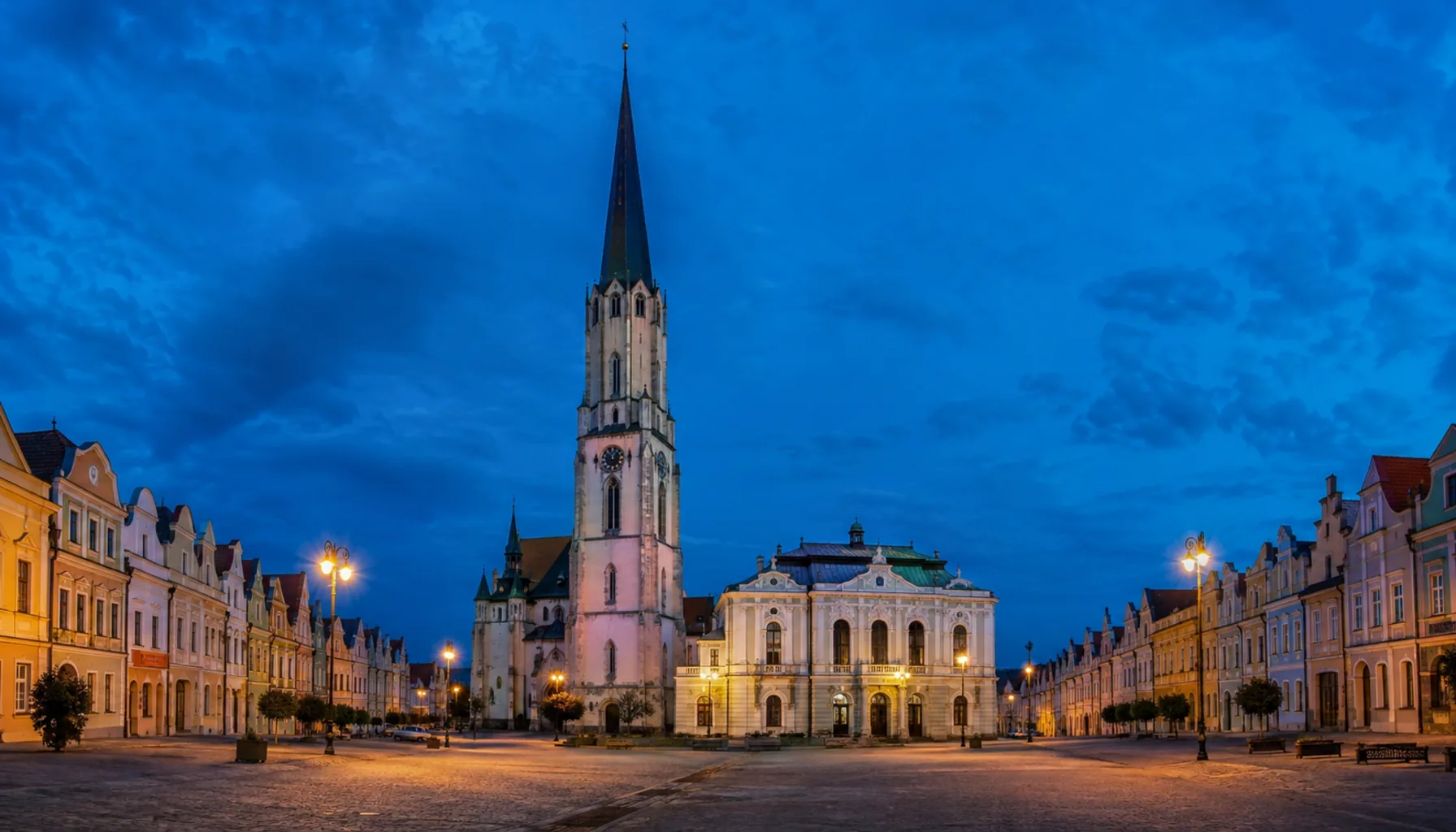 The 87-metre church tower, the tallest in Slovakia, over the lens-shaped square of Spišská Nová Ves at dusk