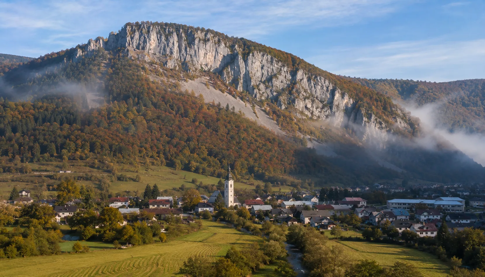 The limestone crag of Hradová standing over Tisovec at the edge of the Muráň plateau