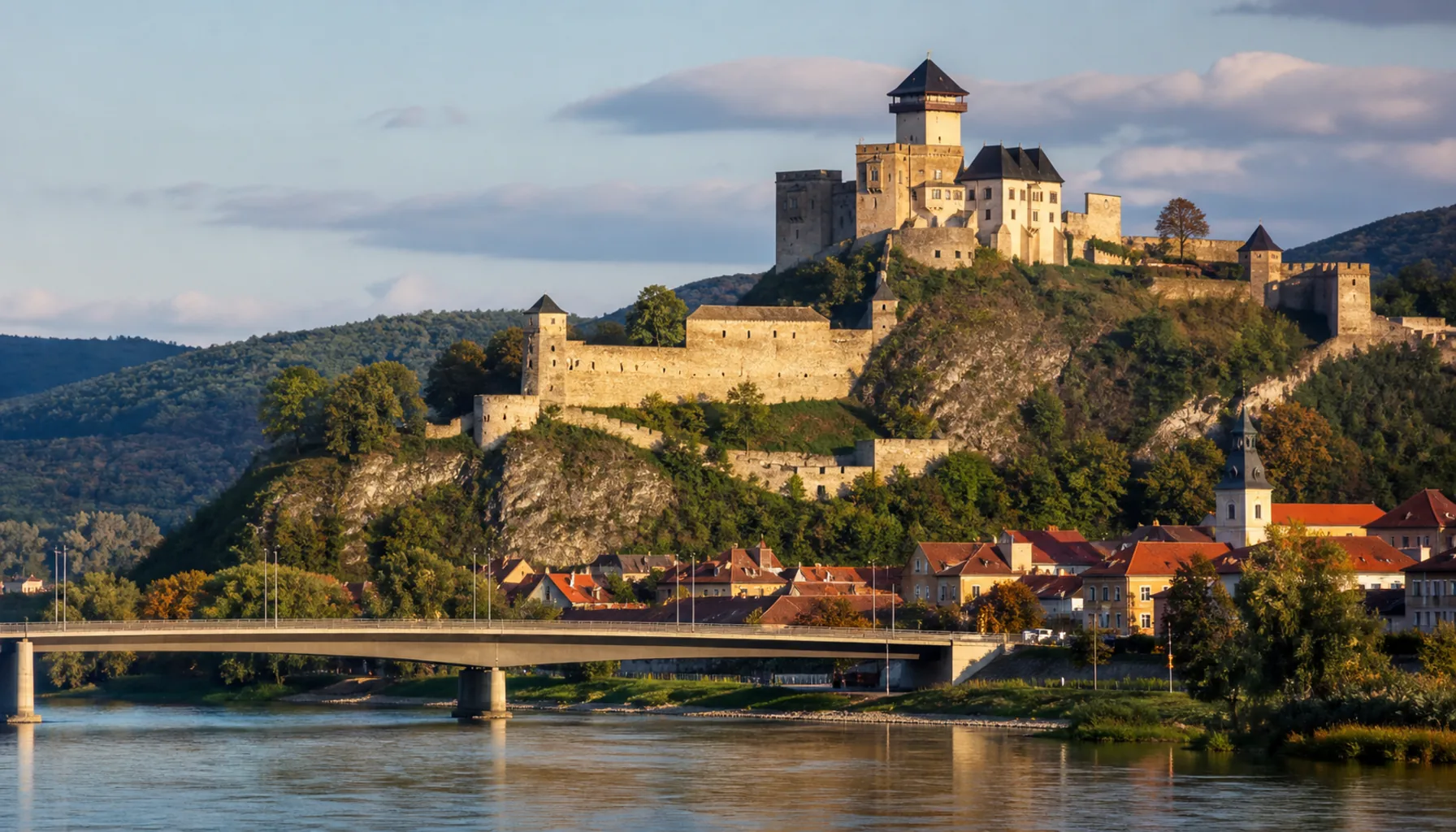 The castle crag straight over the roofs of the town and the Váh