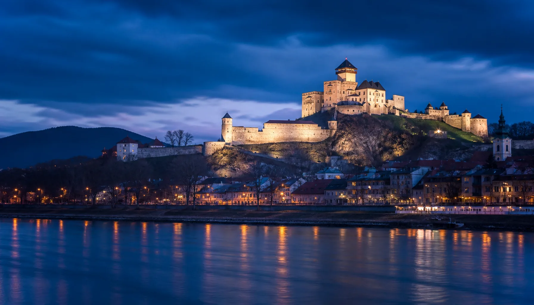 Trenčín Castle at blue hour — page background